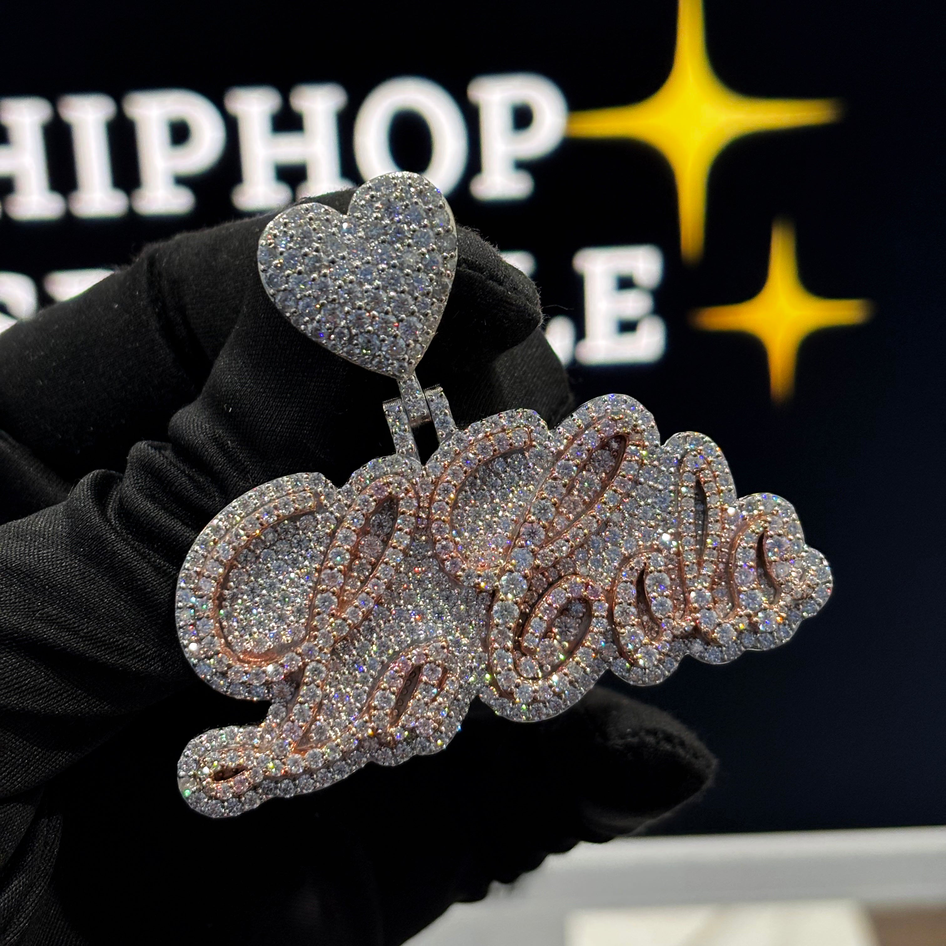 La Cola two-tone rose and white gold iced out moissanite custom name pendant with heart bail